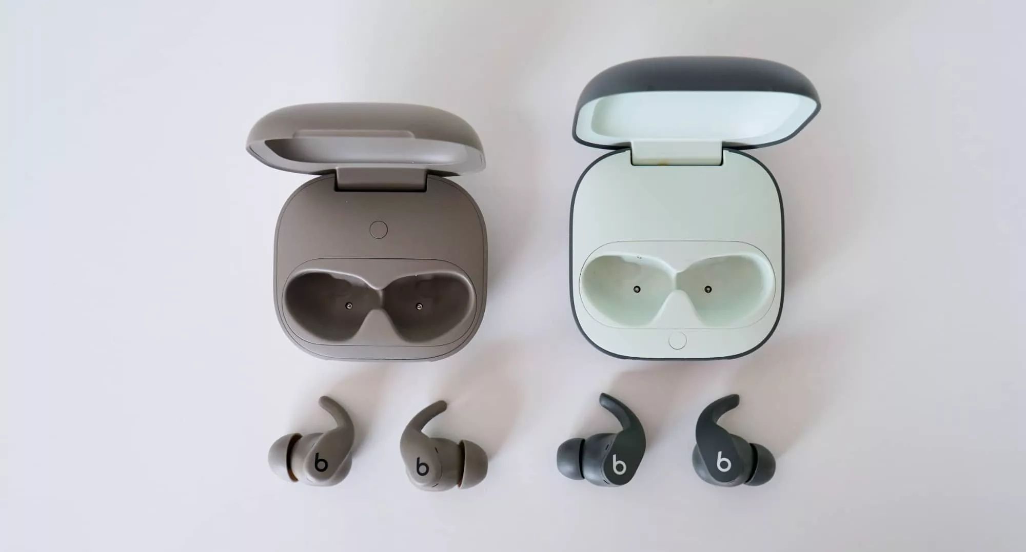 The new model, the Powerbeats Fit (left) is slightly smaller, but beyond that, there's not a lot of difference between them and the Beats Fit Pro (right).